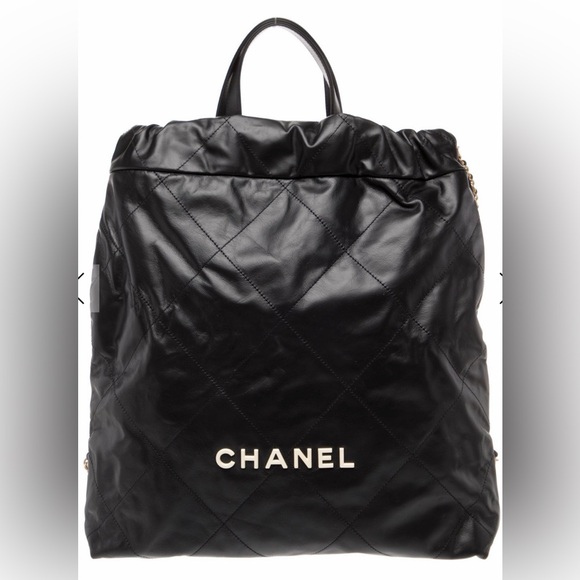 CHANEL Handbags - Chanel NWT 22 Backpack black with gold hardware and RARE white enamel logo